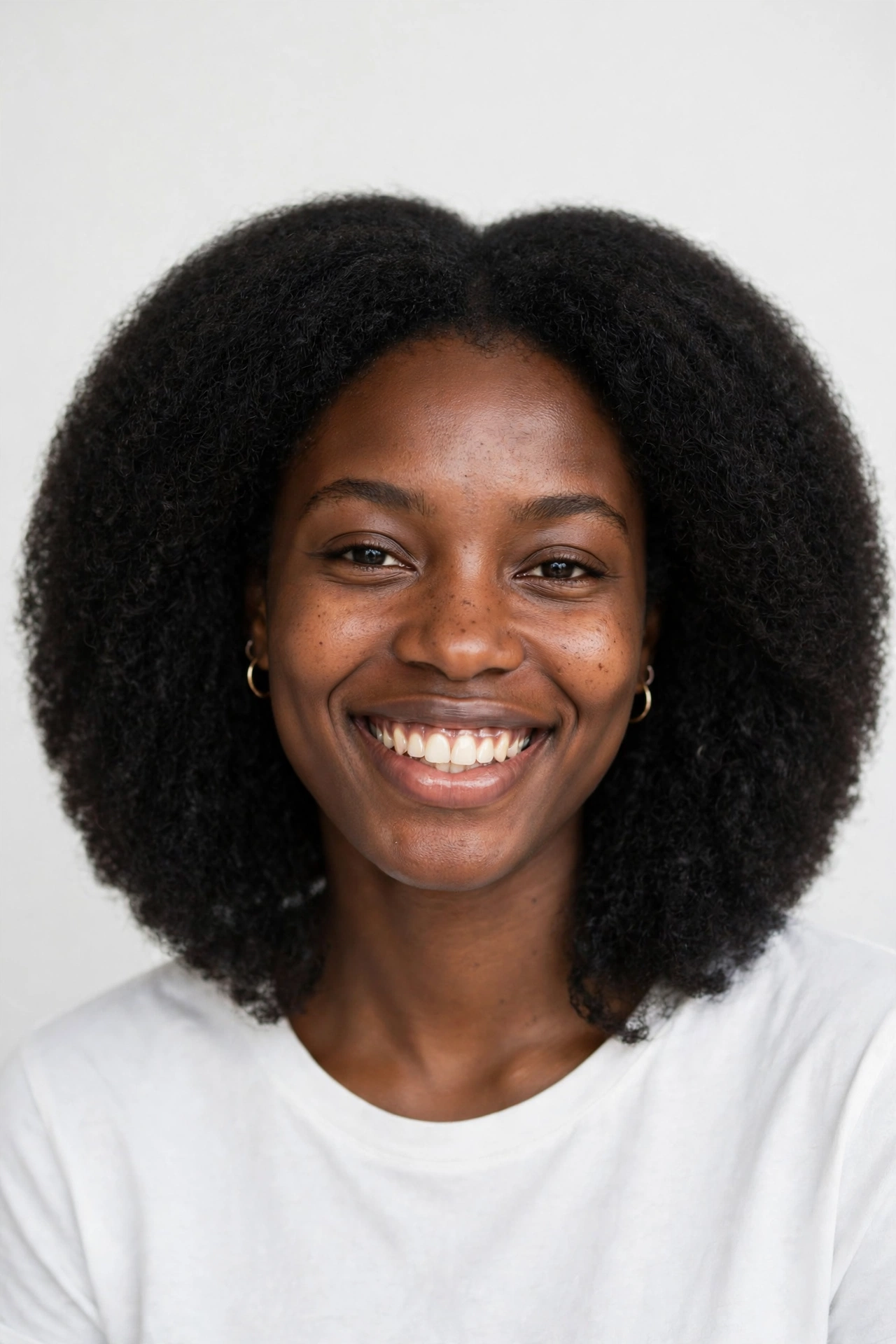 Rounded 4C afro lob with a full soft silhouette