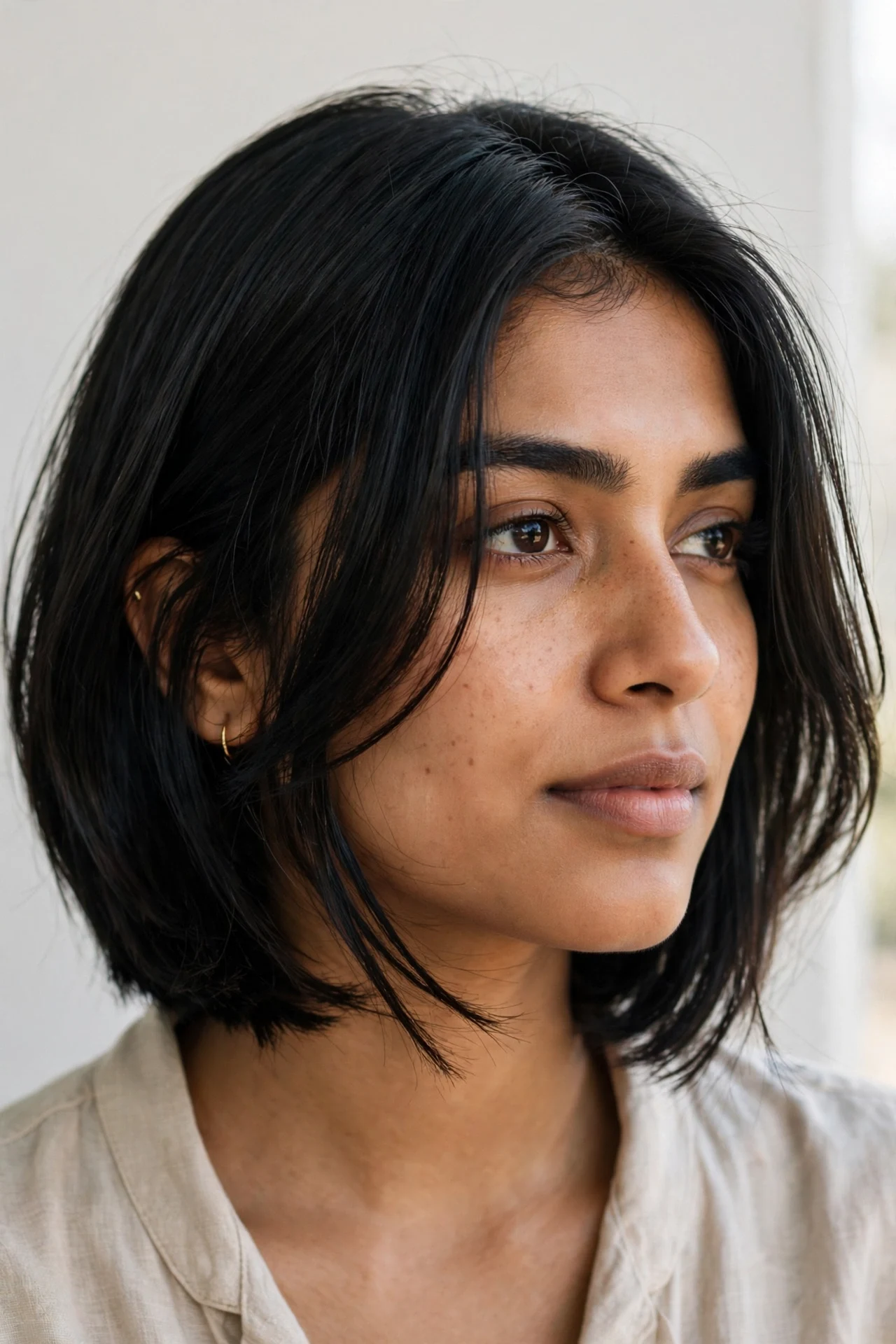Graduated bob with face-framing layers on jet black fine hair