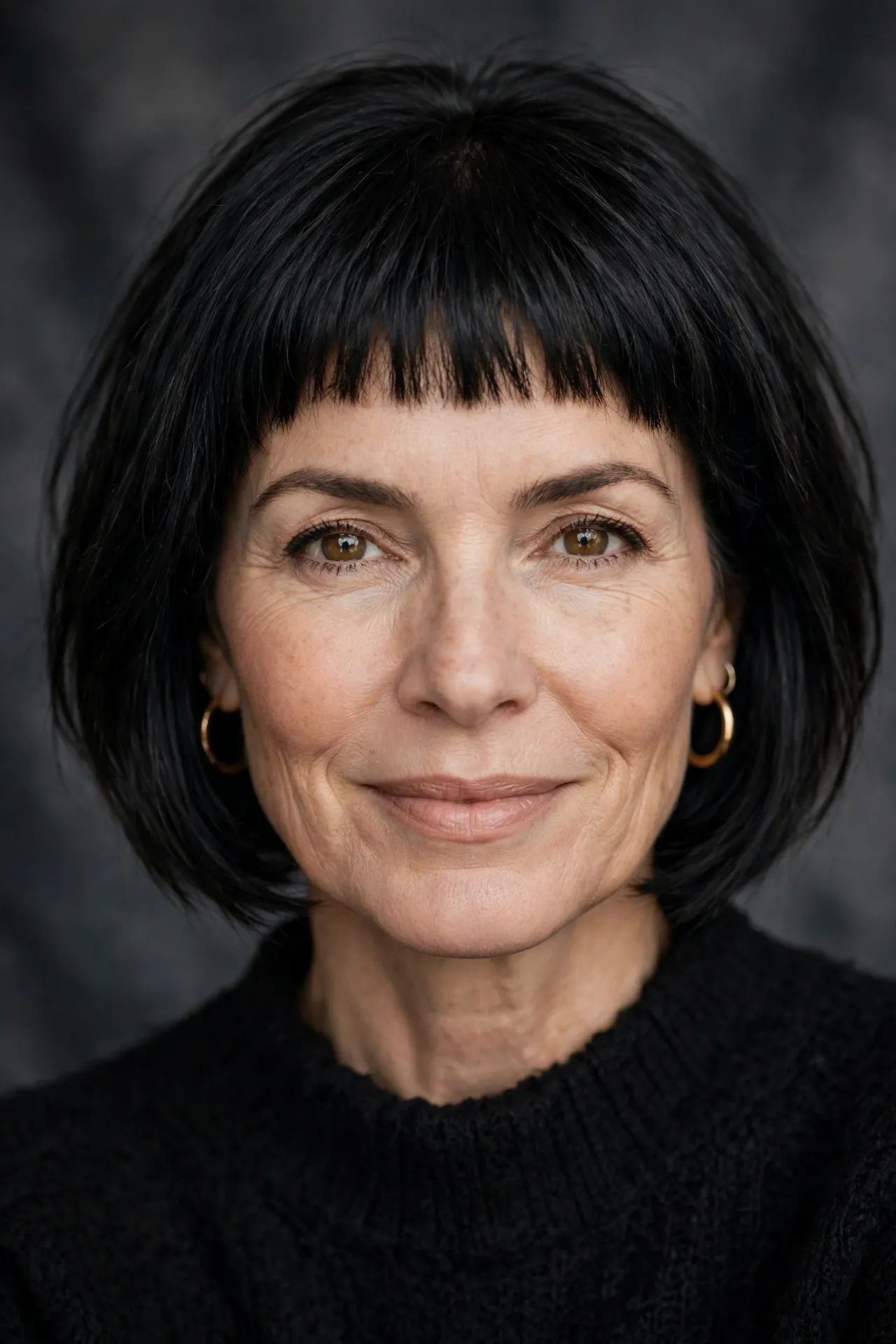 Bold micro fringe layered bob, fine black hair over 50