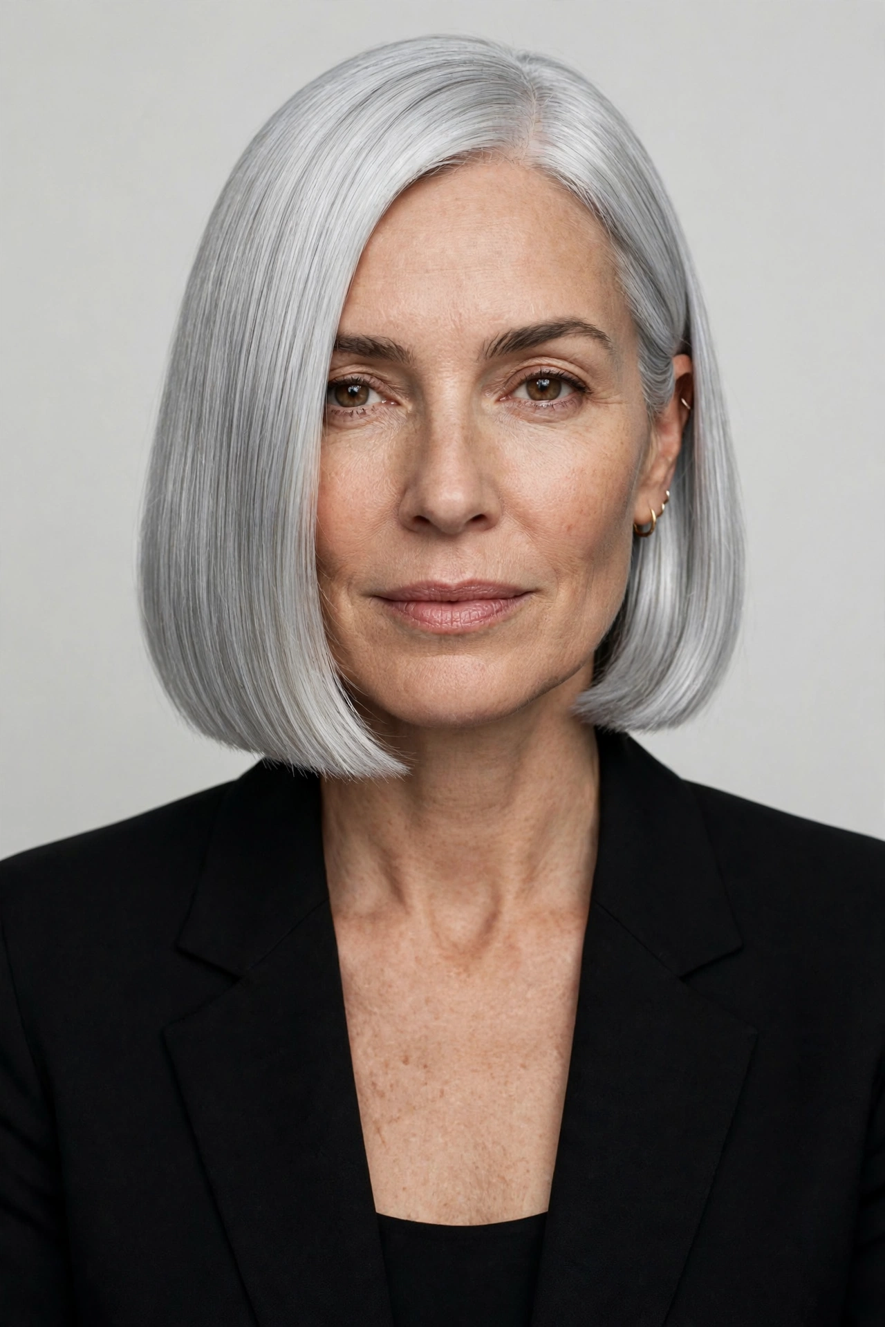 Classic blunt silver bob haircut with a clean chin length finish
