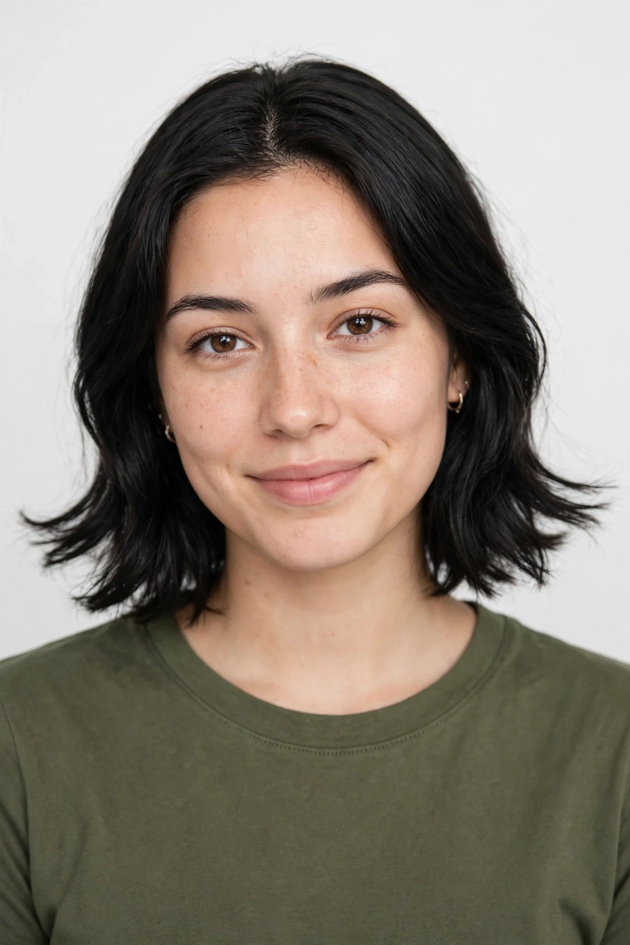 Neck length hair with ends flipping outward during the grow-out stage