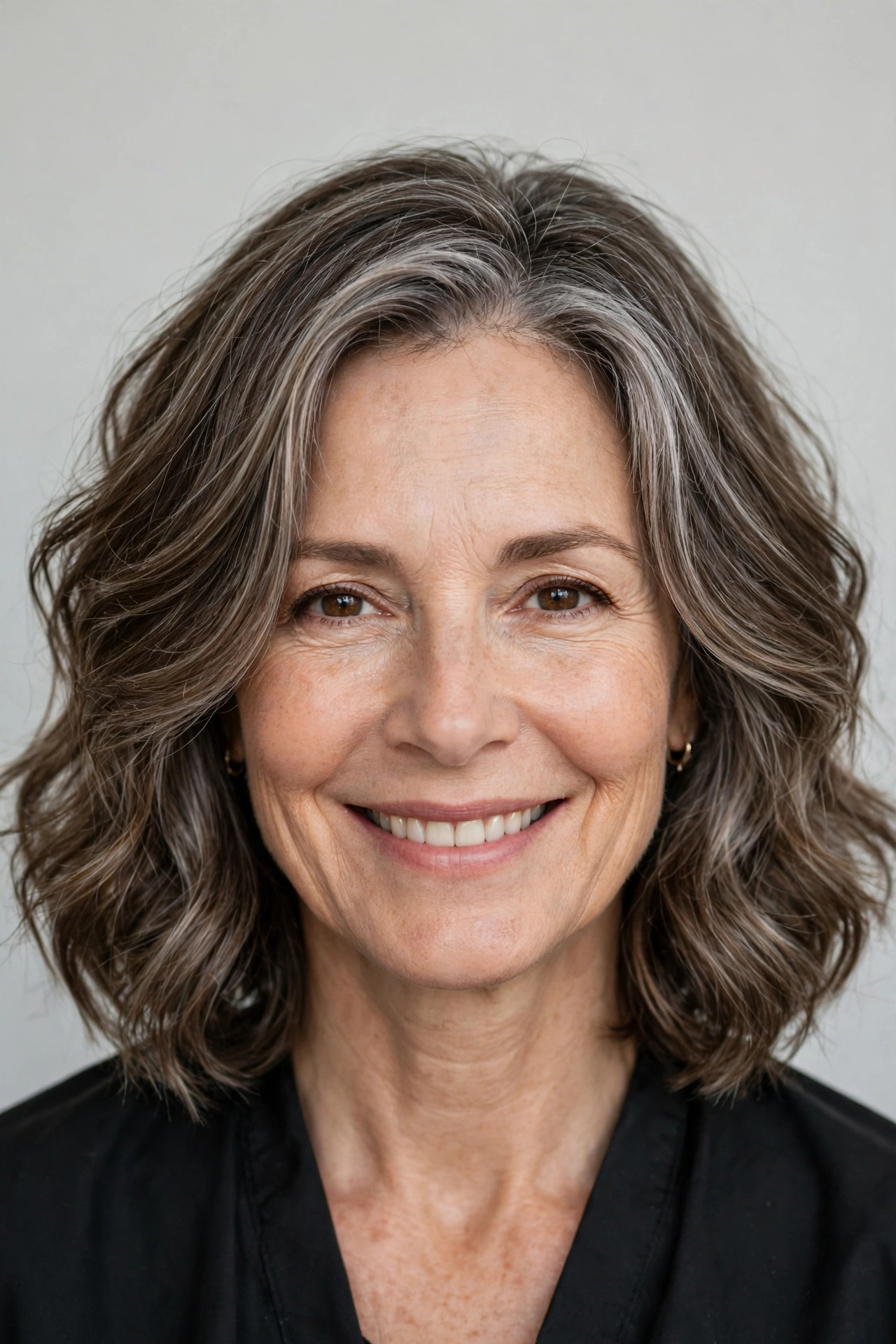 Wavy lob with face framing layers around the cheeks